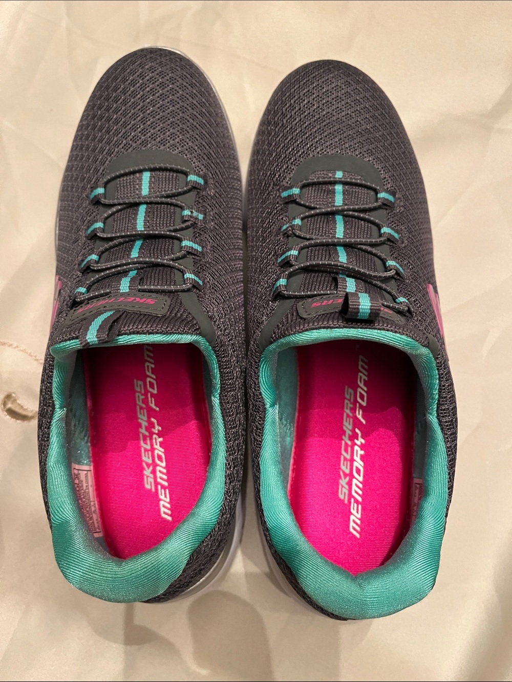 Skechers Women's Black Sneakers with Teal Trim and Pink Insole